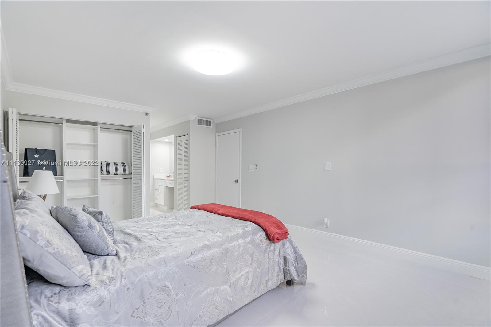 Boca Pointe Boca Raton, FL 33433 - Photo 14 of 41 a bedroom with a bed and a window