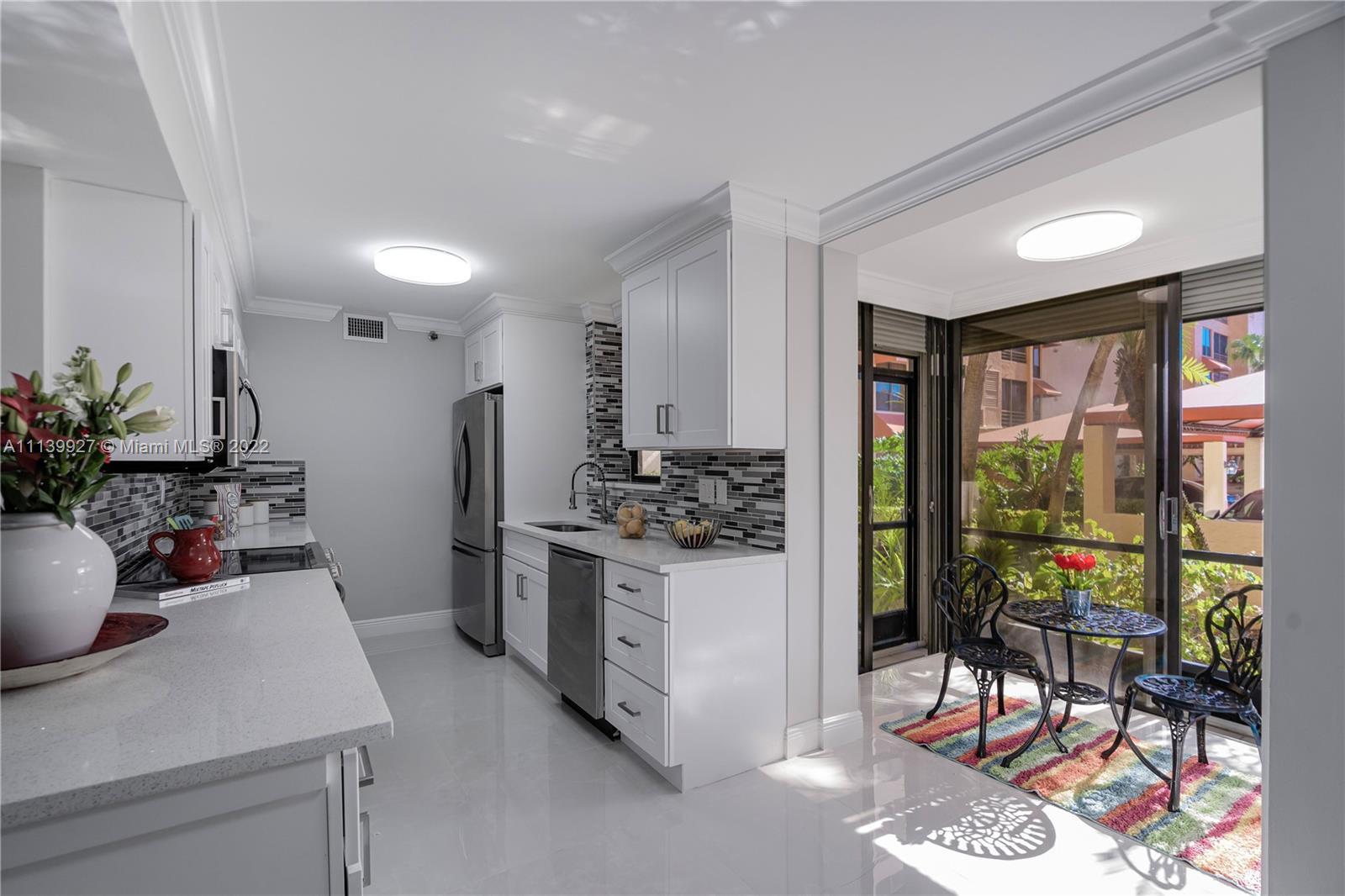 Boca Pointe Boca Raton, FL 33433 - Photo 3 of 41 a kitchen with a table and chairs