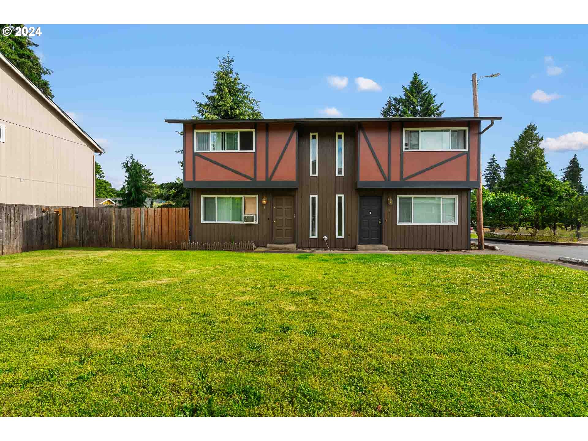 2015 Carlson Road Vancouver, WA 98661 - Photo 3 of 14 a front view of a house with a yard