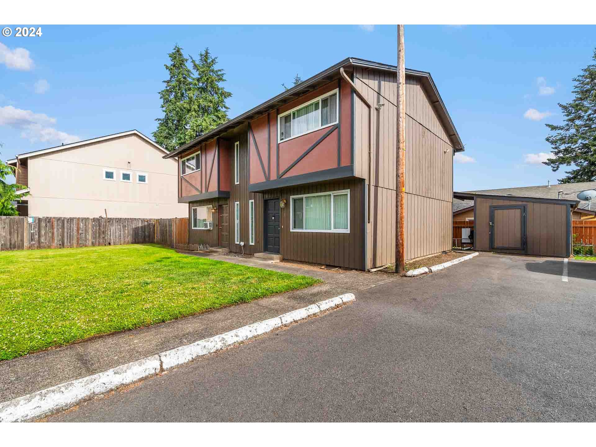 2015 Carlson Road Vancouver, WA 98661 - Photo 8 of 14 a front view of a house with a yard and garage