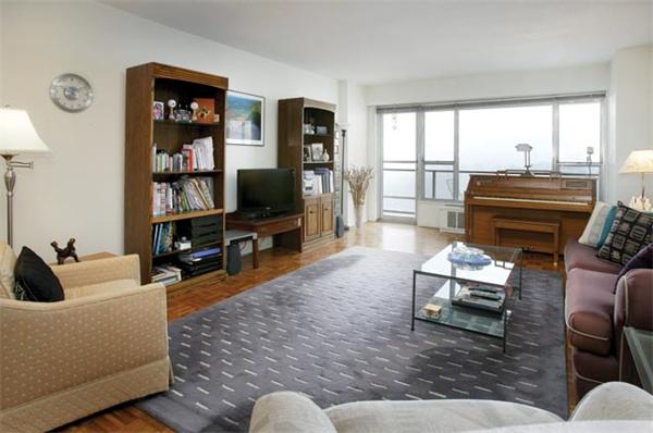 111 Perkins Street, Unit 124 Boston, MA 02130 - Photo 2 of 9 a living room with furniture and a flat screen tv with wooden floor