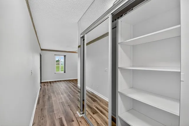 a view of balcony with furniture and floor to ceiling window