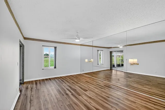 a view of a room with wooden floor and balcony