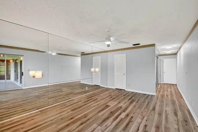 a view of a porch with a table and chairs