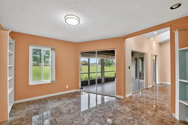 an aerial view of residential houses with outdoor space and swimming pool