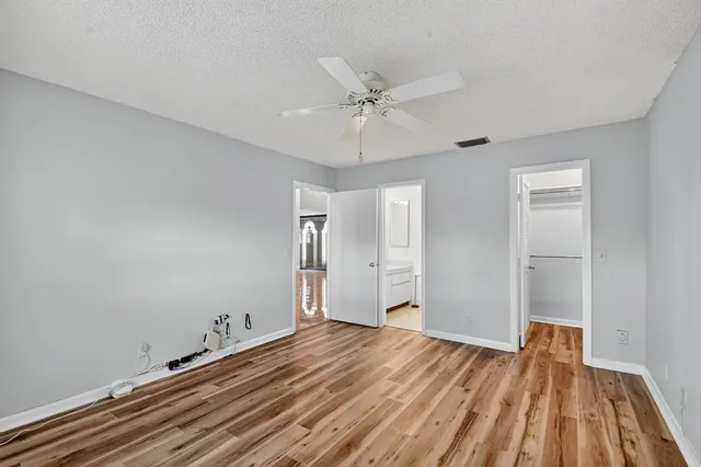 an aerial view of residential houses with outdoor space and swimming pool