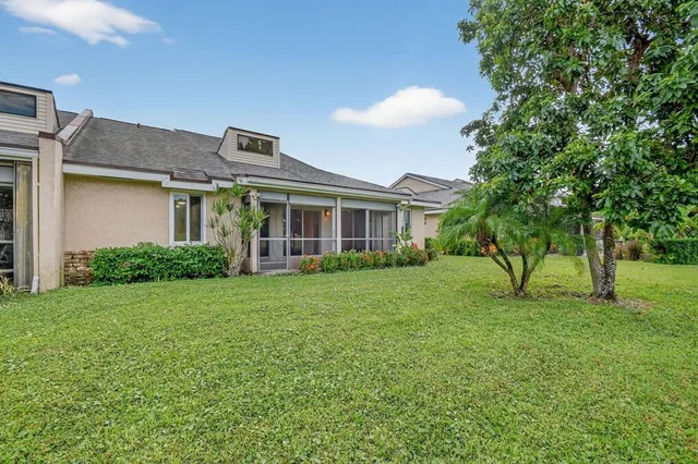an aerial view of a house with a garden