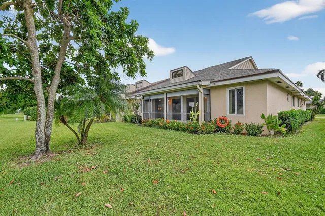 a bird view of multi story residential apartment building with yard