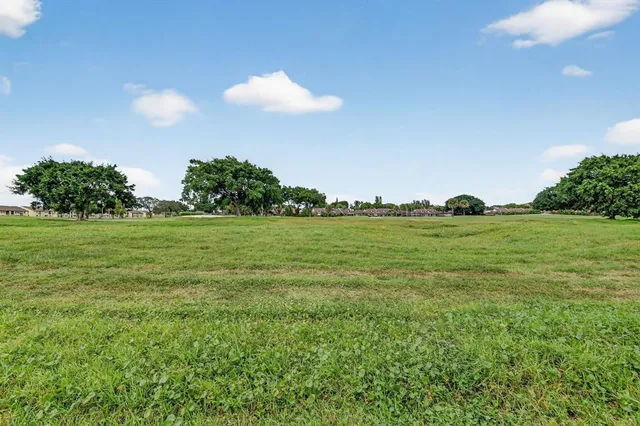 a view of a lake with houses in the background