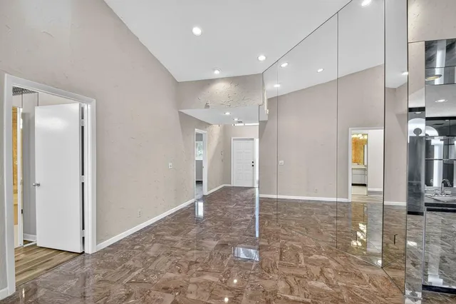 a kitchen with stainless steel appliances a sink microwave and stove