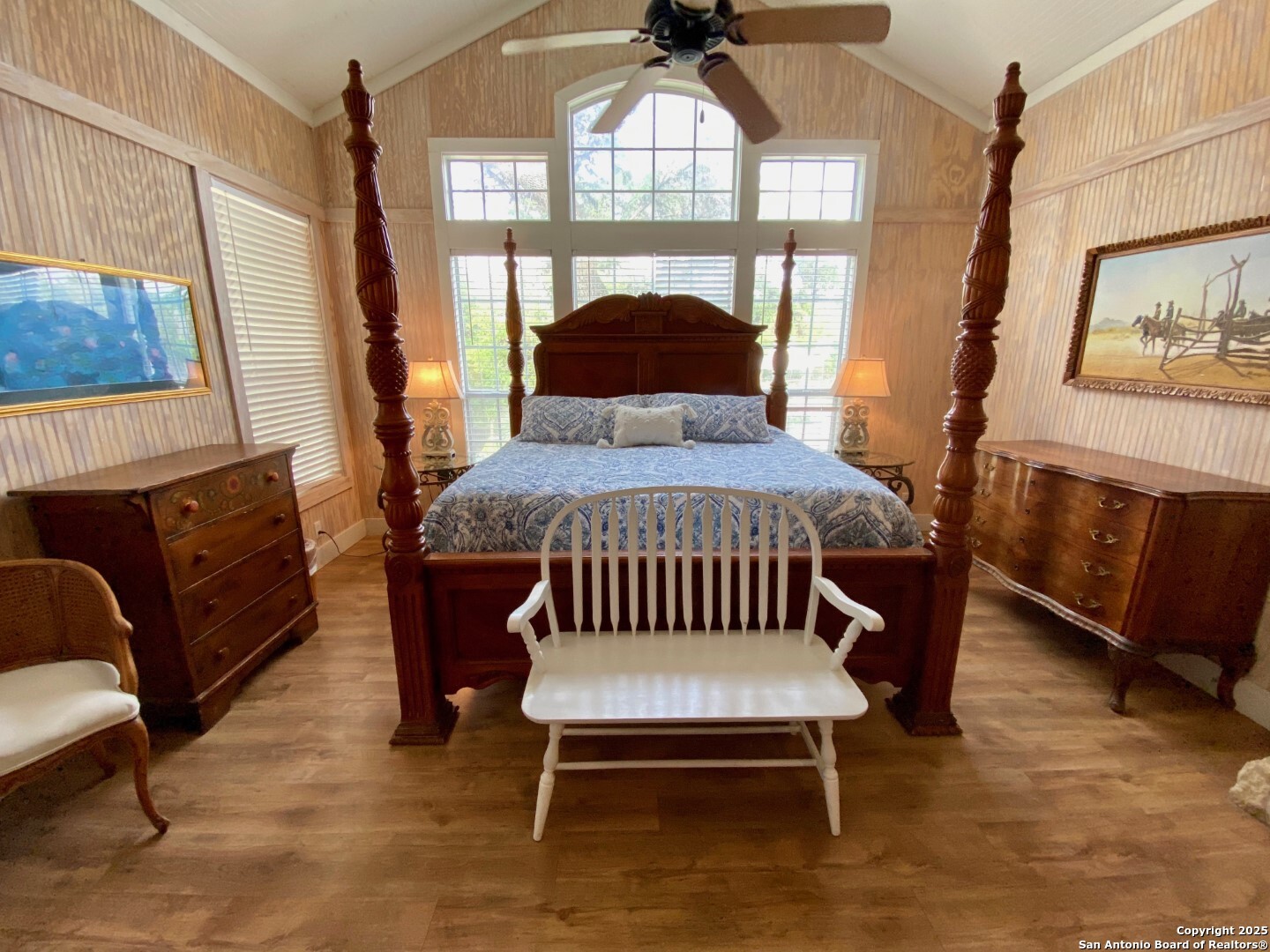 512 County Road 348 Concan, TX 78838 - Photo 25 of 39 a bedroom with a bed a mirror and a window