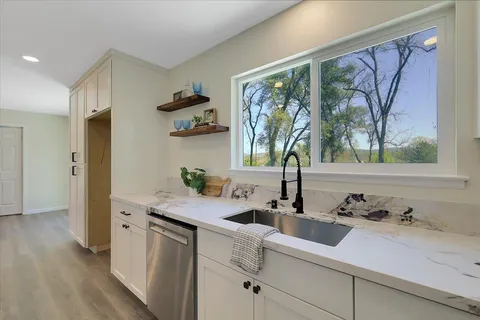 a kitchen with a sink and a window