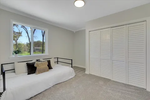 a view of a city with lush green forest