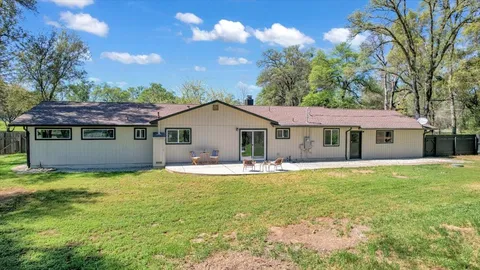 a view of a yard with swimming pool