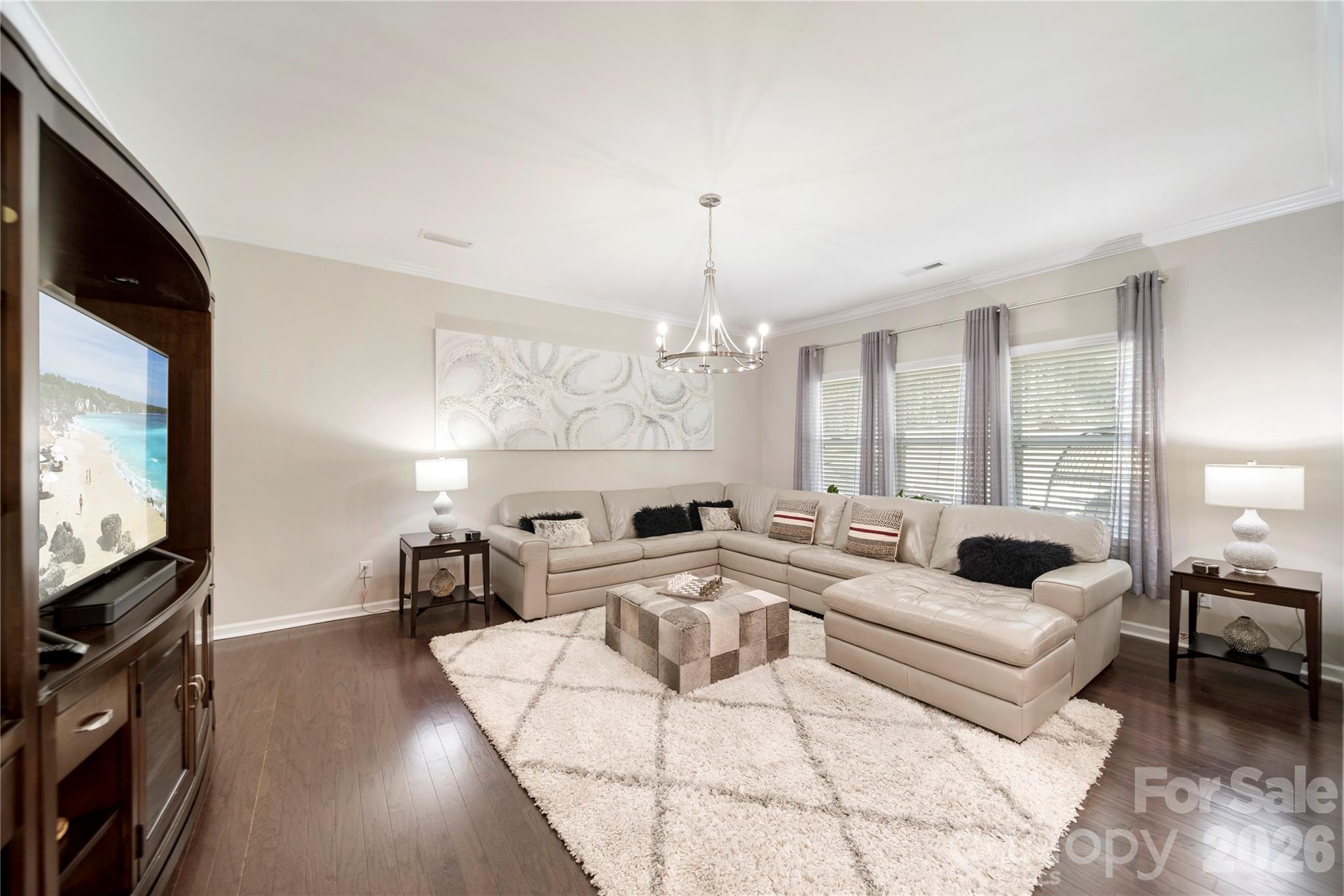8122 Mossy Rock Road Waxhaw, NC 28173 - Photo 6 of 28 a living room with fireplace furniture and a flat screen tv