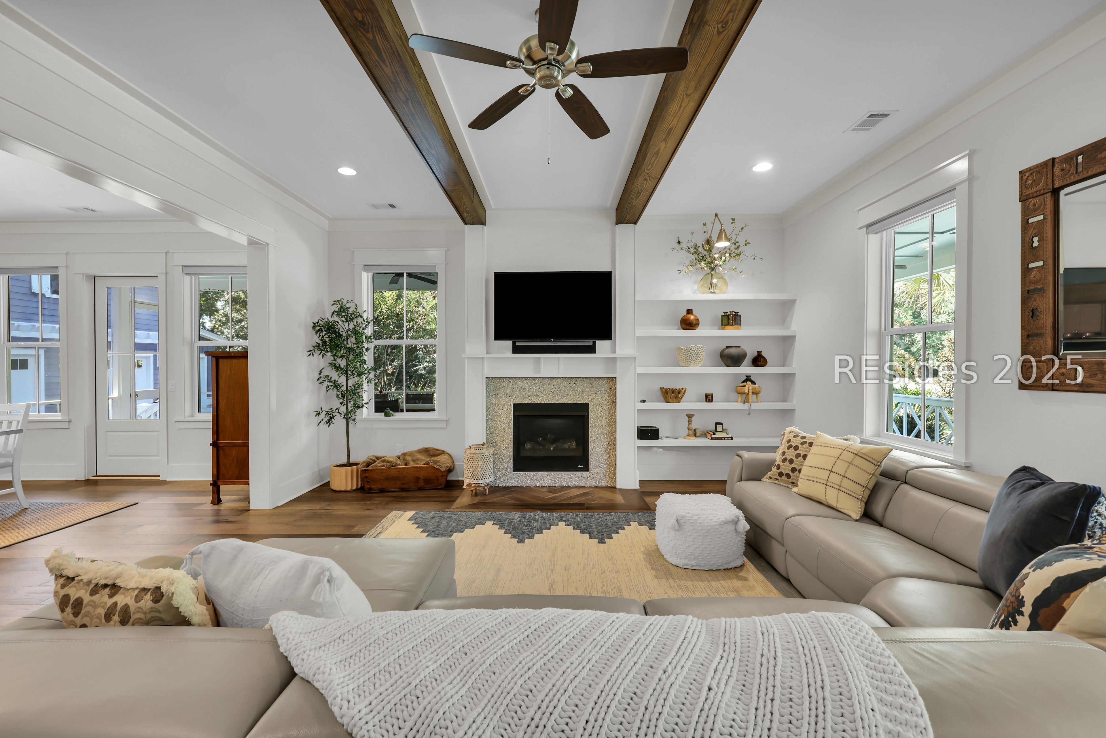 2 Oldfield Village Road Bluffton, SC 29909 - Photo 3 of 37 Expansive living room with tabby gas fireplace