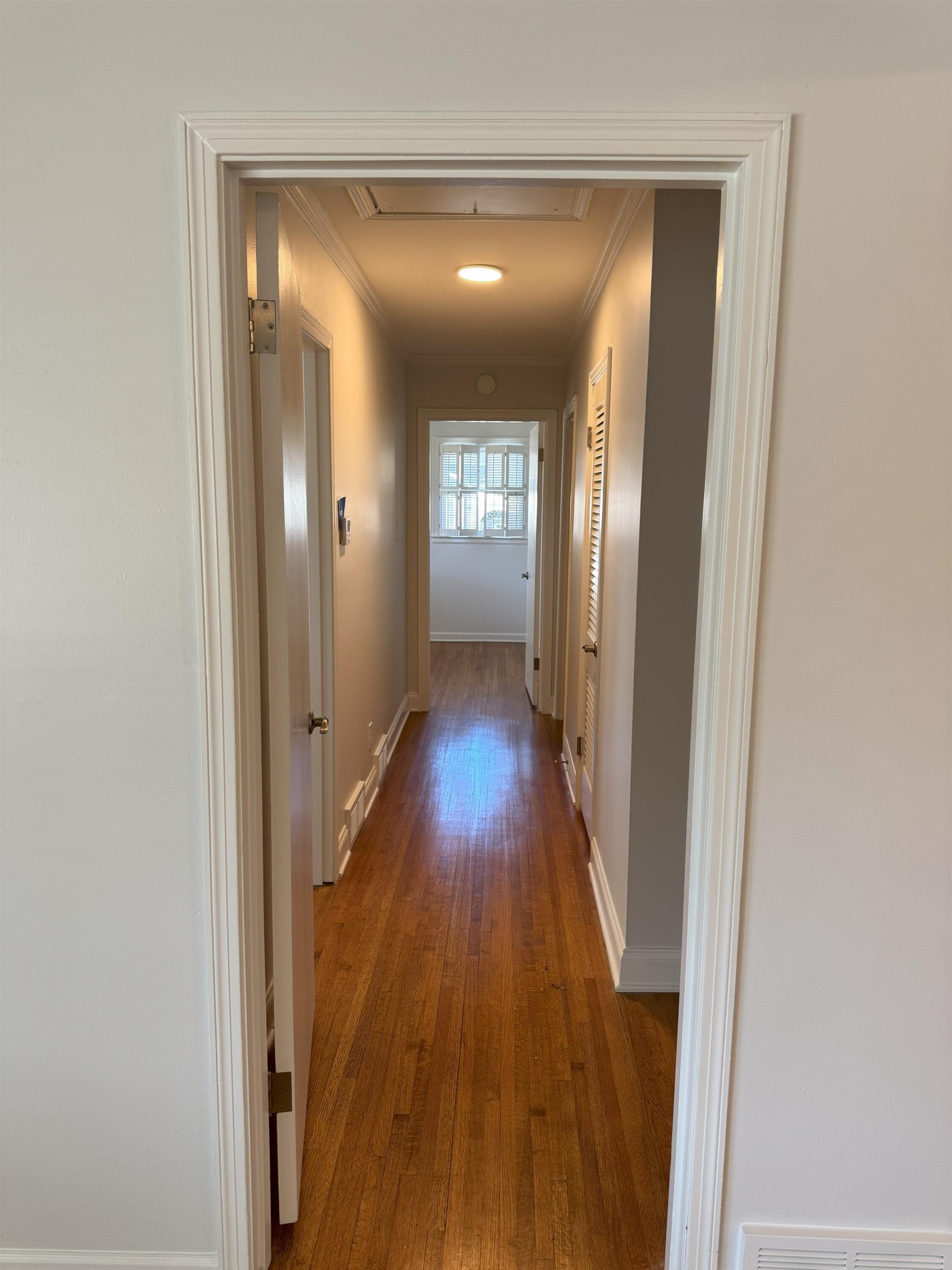 4803 Hummingbird Lane Memphis, TN 38117 - Photo 11 of 36 a view of a hallway with wooden floor