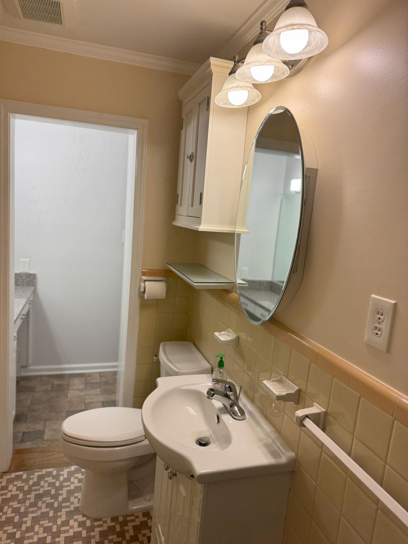 4803 Hummingbird Lane Memphis, TN 38117 - Photo 18 of 36 a bathroom with a sink a toilet and mirror