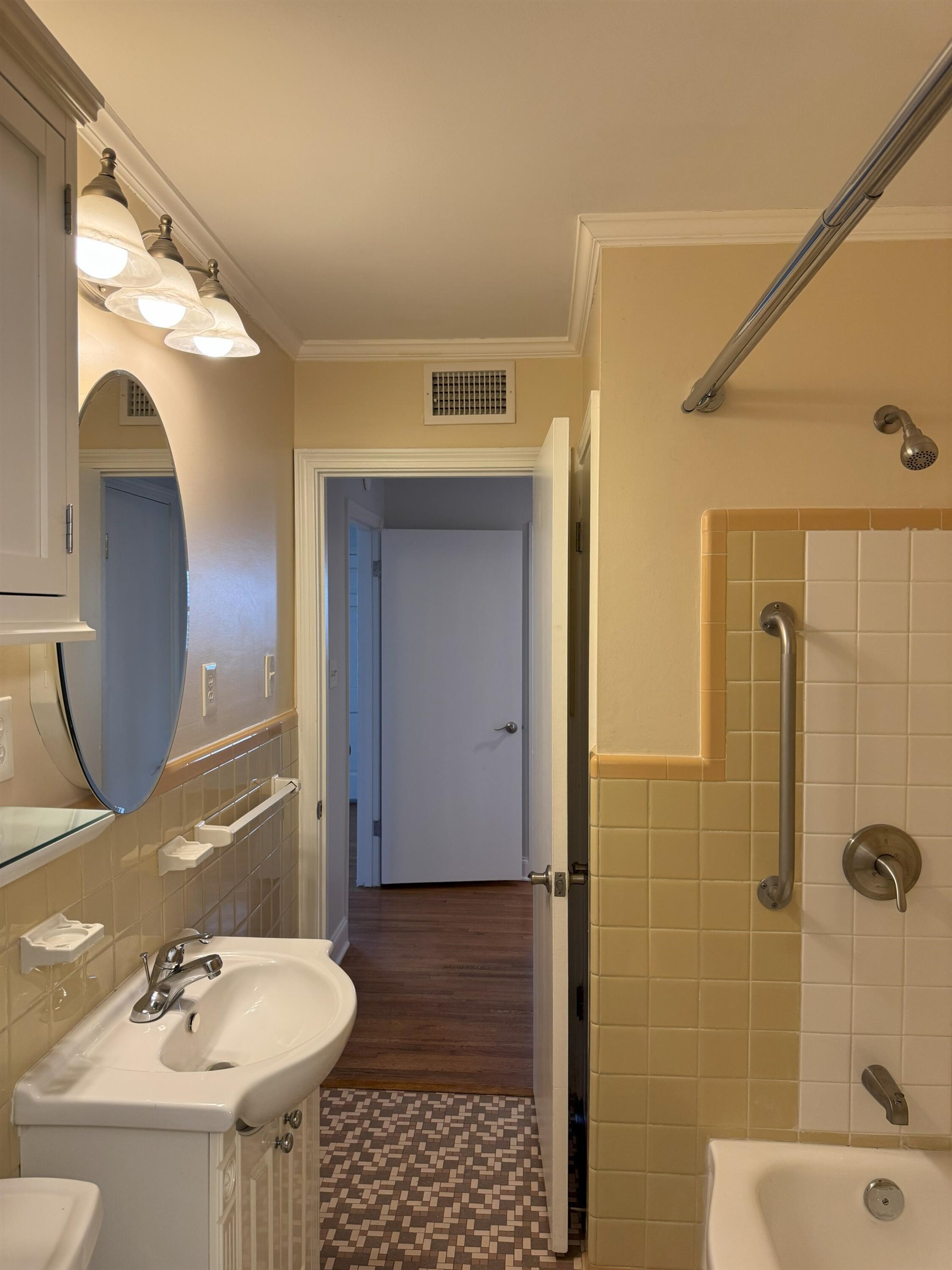 4803 Hummingbird Lane Memphis, TN 38117 - Photo 20 of 36 a bathroom with a sink and mirror