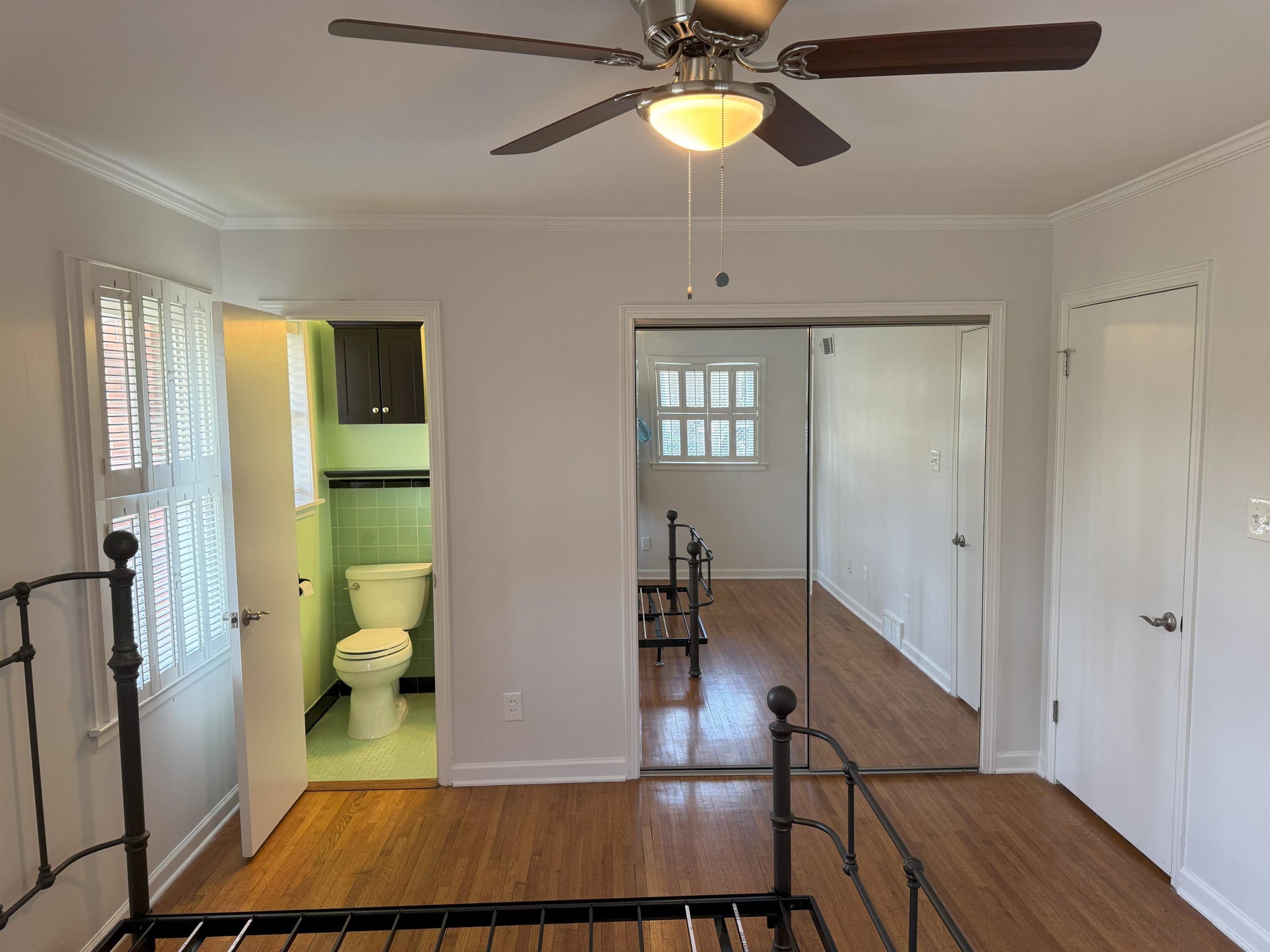 4803 Hummingbird Lane Memphis, TN 38117 - Photo 26 of 36 a view of a room with wooden floor and staircase