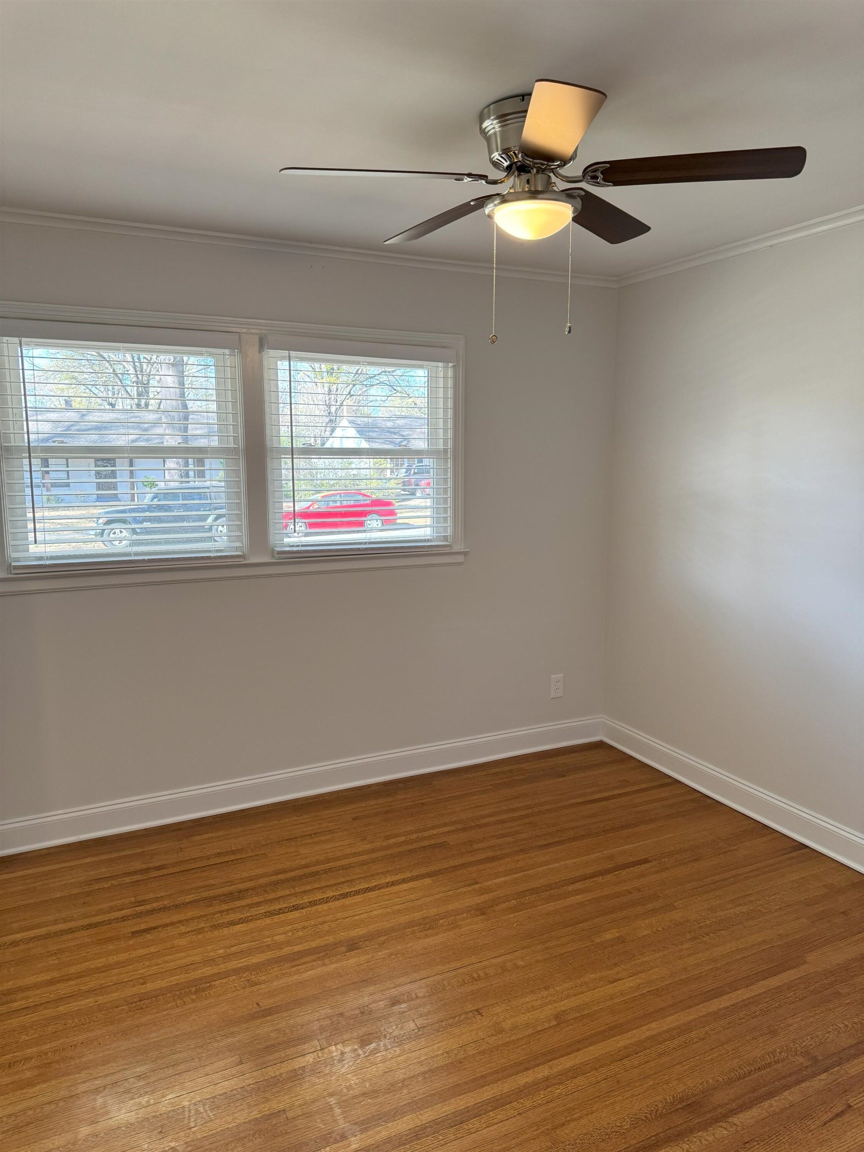 4803 Hummingbird Lane Memphis, TN 38117 - Photo 29 of 36 a view of an empty room with window and wooden floor