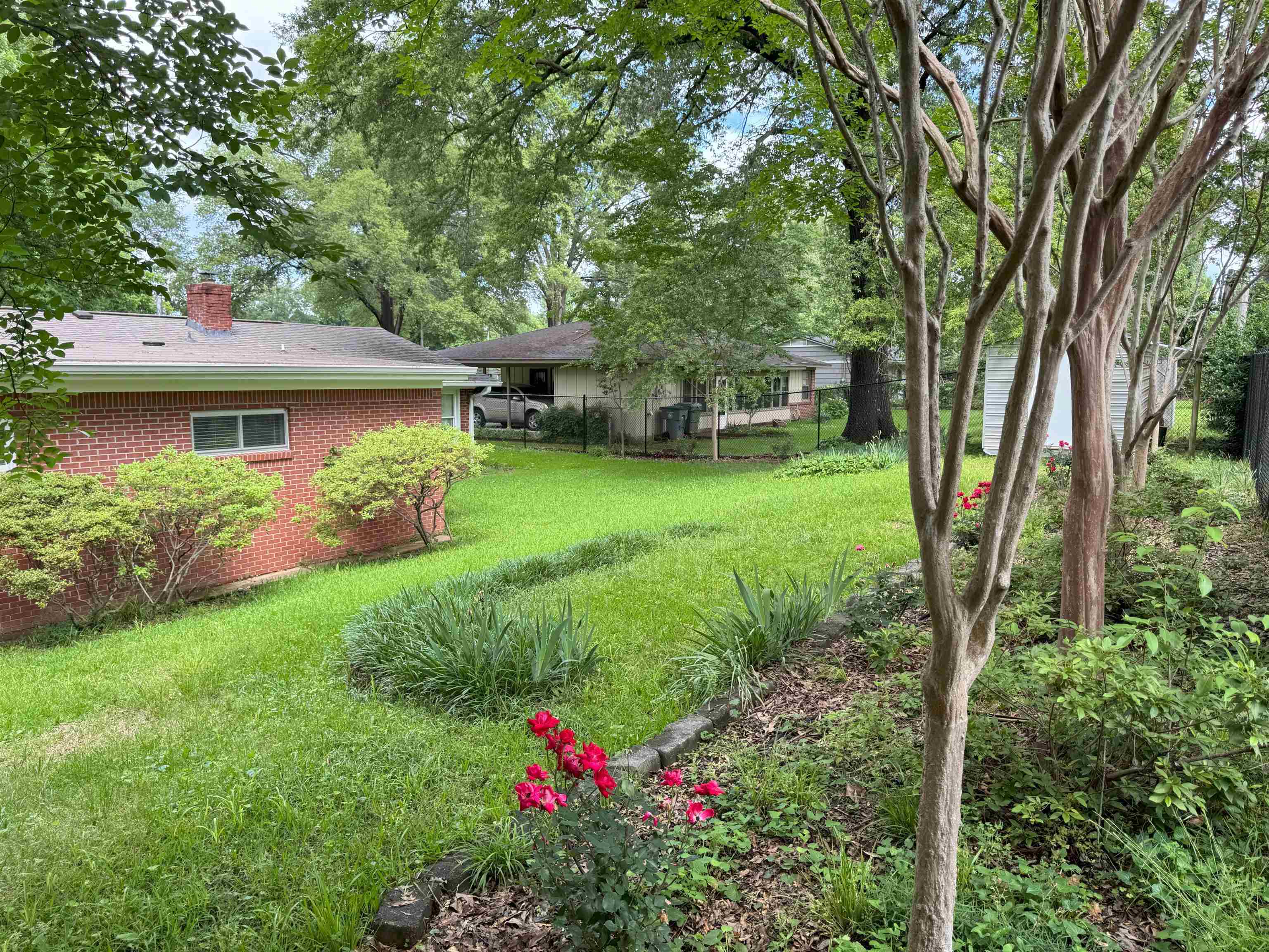 4803 Hummingbird Lane Memphis, TN 38117 - Photo 5 of 36 a front view of a house with garden