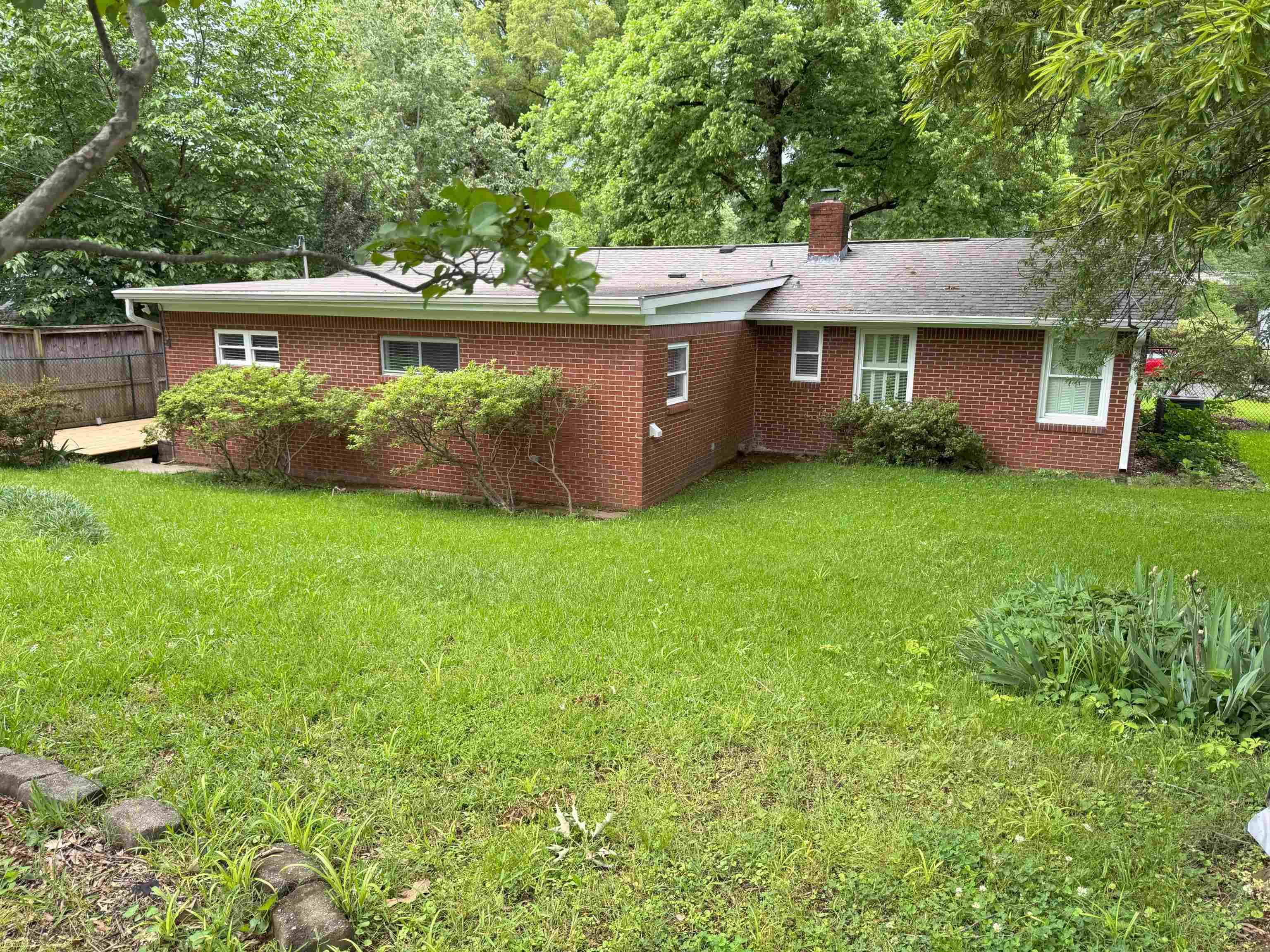 4803 Hummingbird Lane Memphis, TN 38117 - Photo 6 of 36 a front view of a house with garden