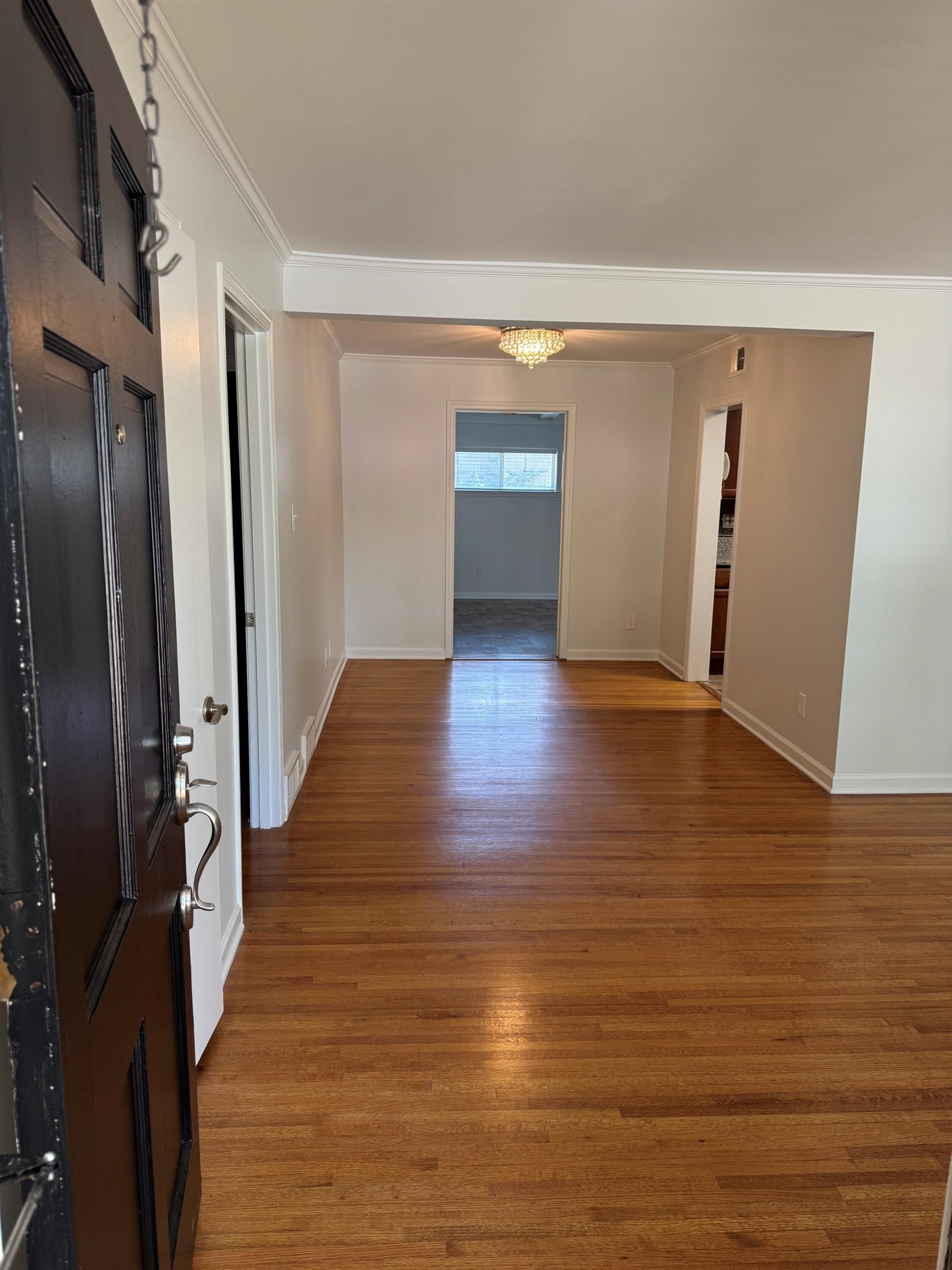 4803 Hummingbird Lane Memphis, TN 38117 - Photo 7 of 36 a view of a hallway with wooden floor