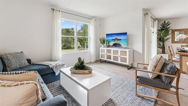 a living room with furniture and a window