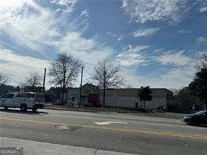 a view of street with parked cars