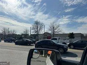a view of street with parked cars