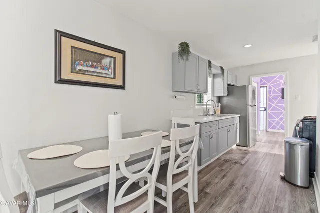 a kitchen with a sink cabinets and window