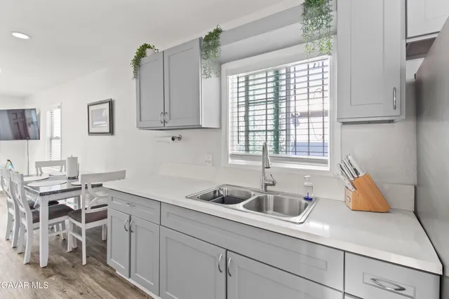 a kitchen with a stove and a microwave