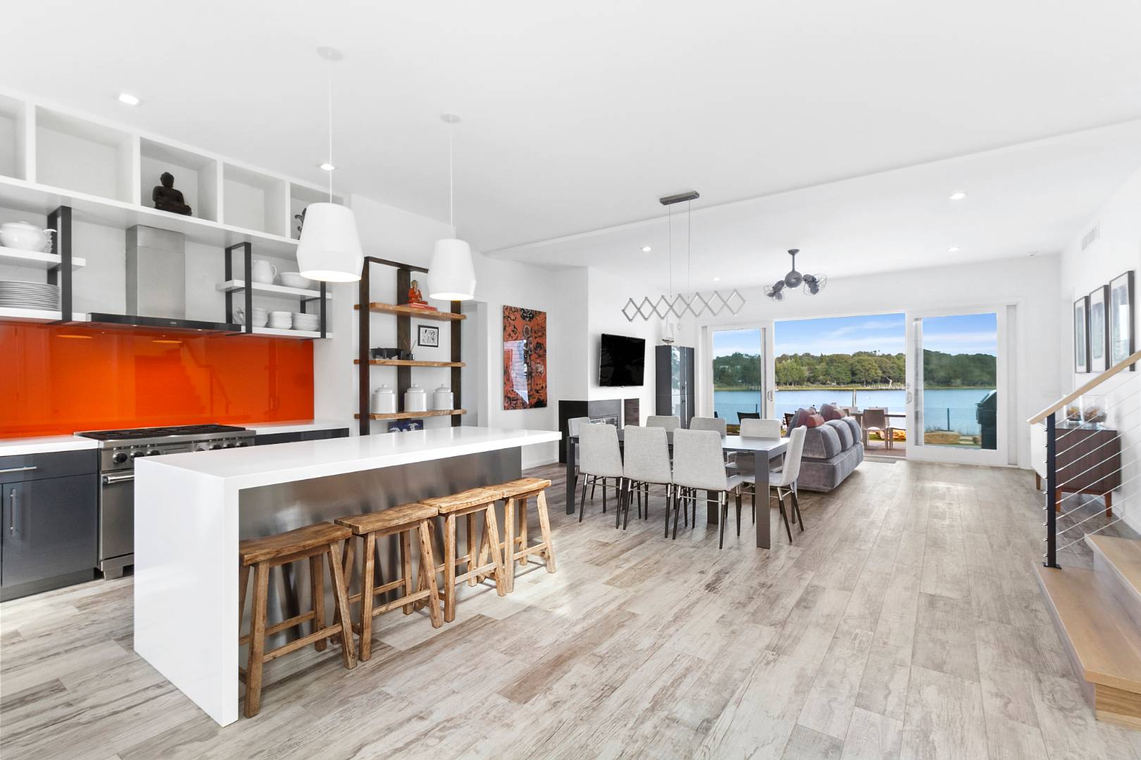 43 Harbor Drive Sag Harbor, NY 11963 - Photo 14 of 29 a living room with furniture a flat screen tv and a large window