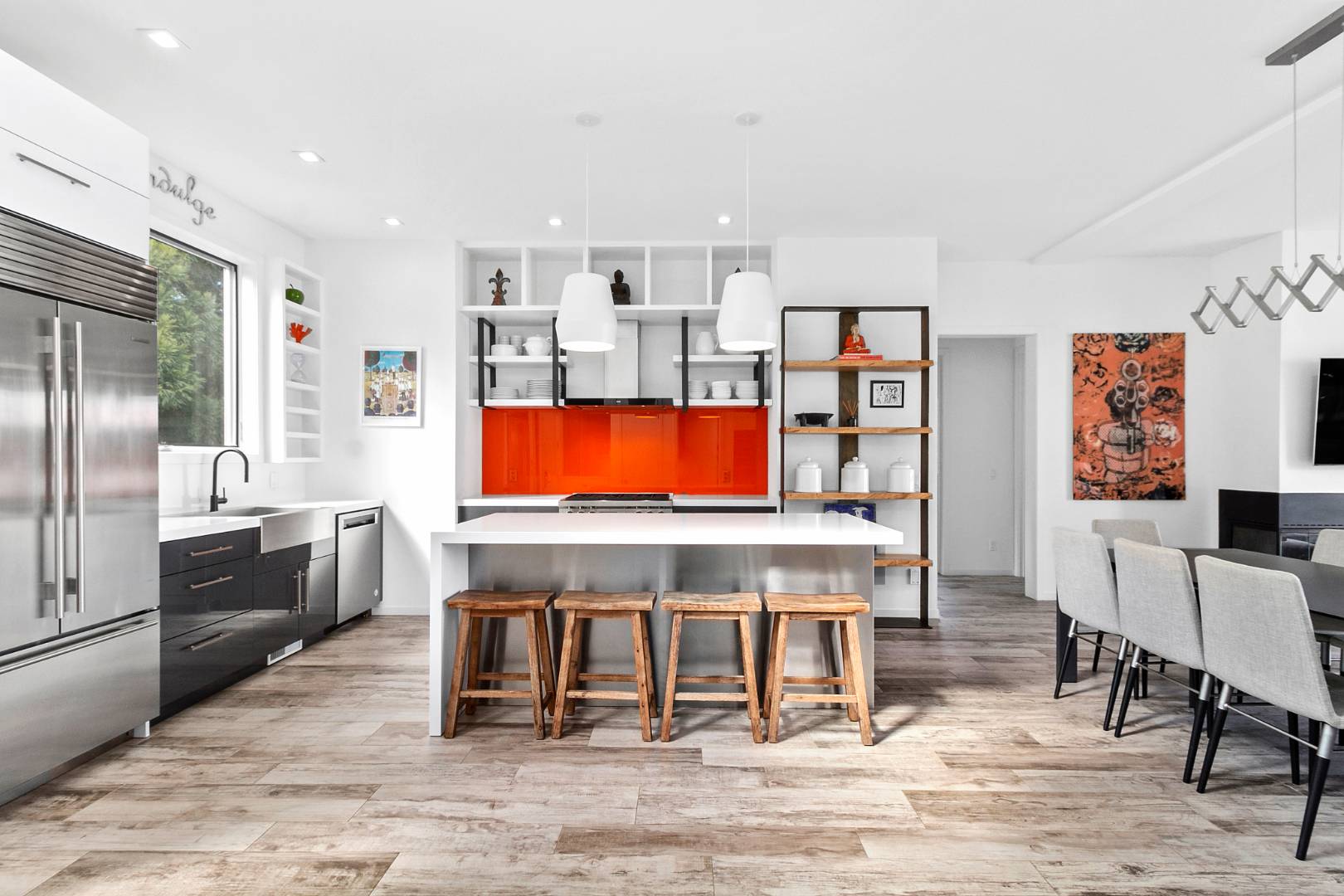 43 Harbor Drive Sag Harbor, NY 11963 - Photo 15 of 29 a living room with stainless steel appliances furniture a rug and a kitchen view