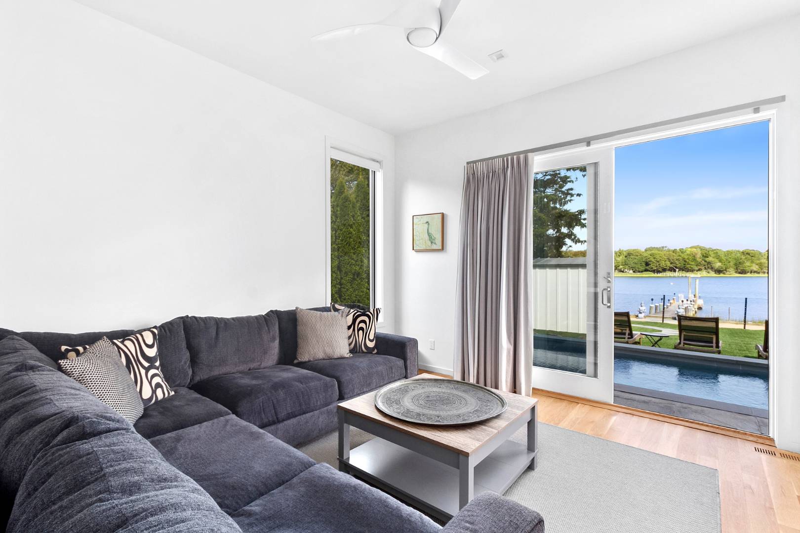 43 Harbor Drive Sag Harbor, NY 11963 - Photo 19 of 29 a living room with furniture and a floor to ceiling window