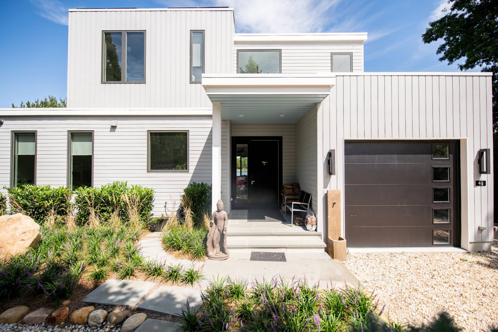 43 Harbor Drive Sag Harbor, NY 11963 - Photo 2 of 29 front view of a house with a yard