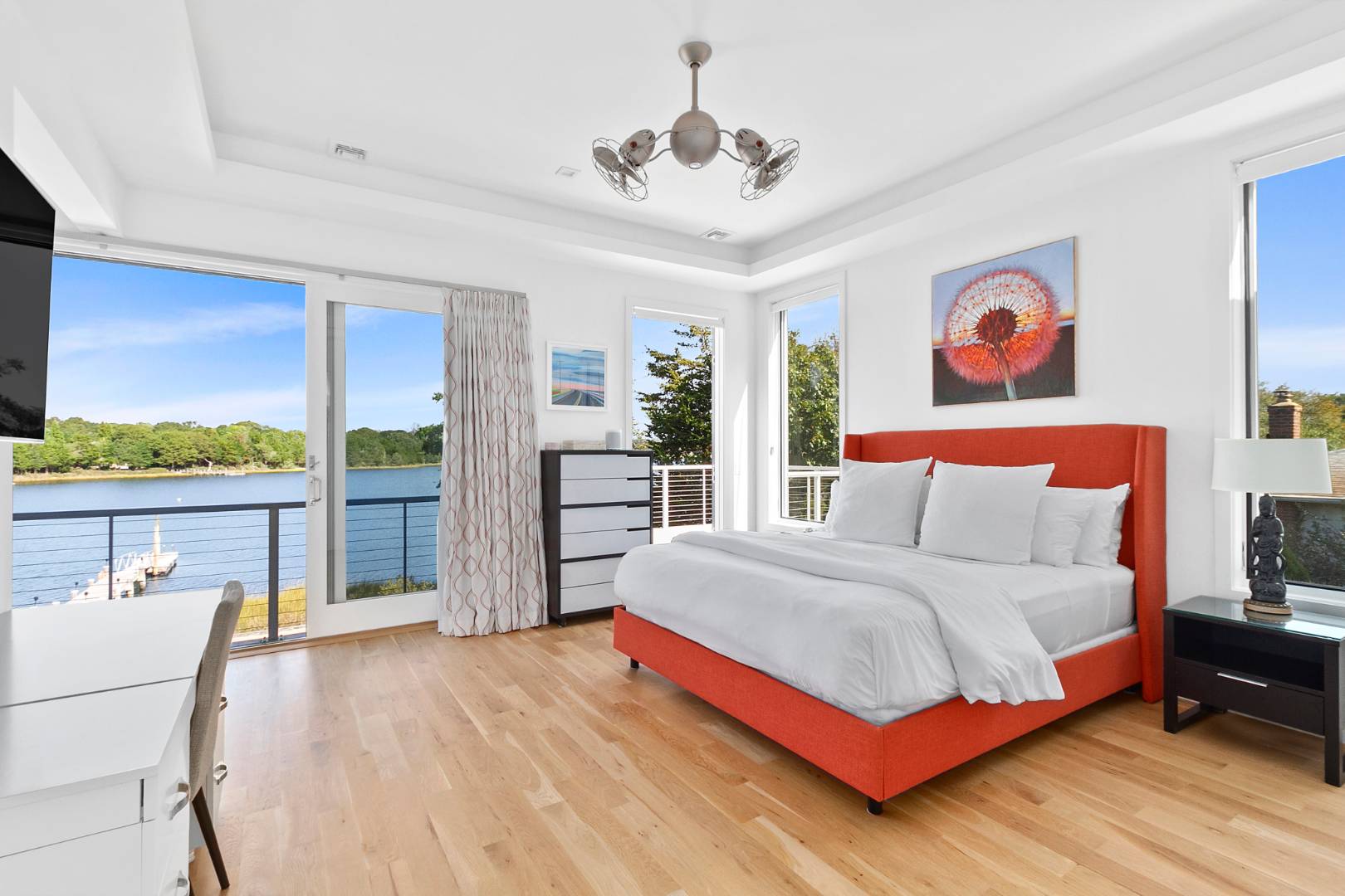 43 Harbor Drive Sag Harbor, NY 11963 - Photo 25 of 29 a bedroom with a bed and a large window