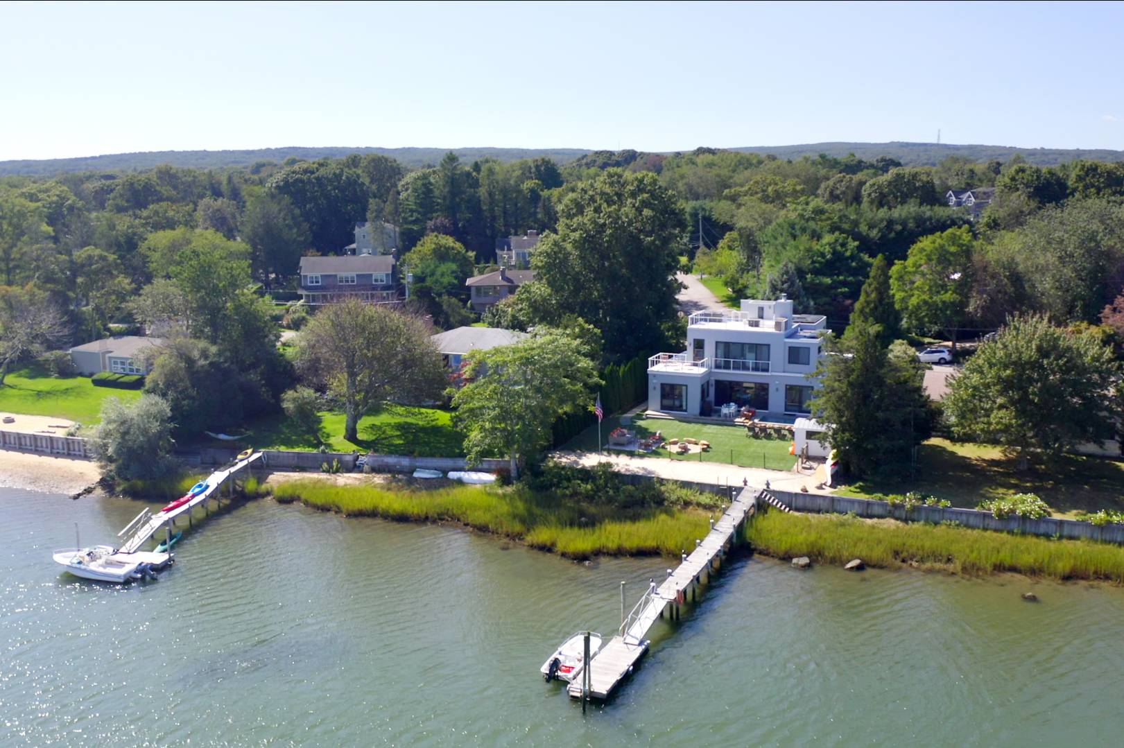 43 Harbor Drive Sag Harbor, NY 11963 - Photo 5 of 29 an aerial view of a house with a garden and lake view