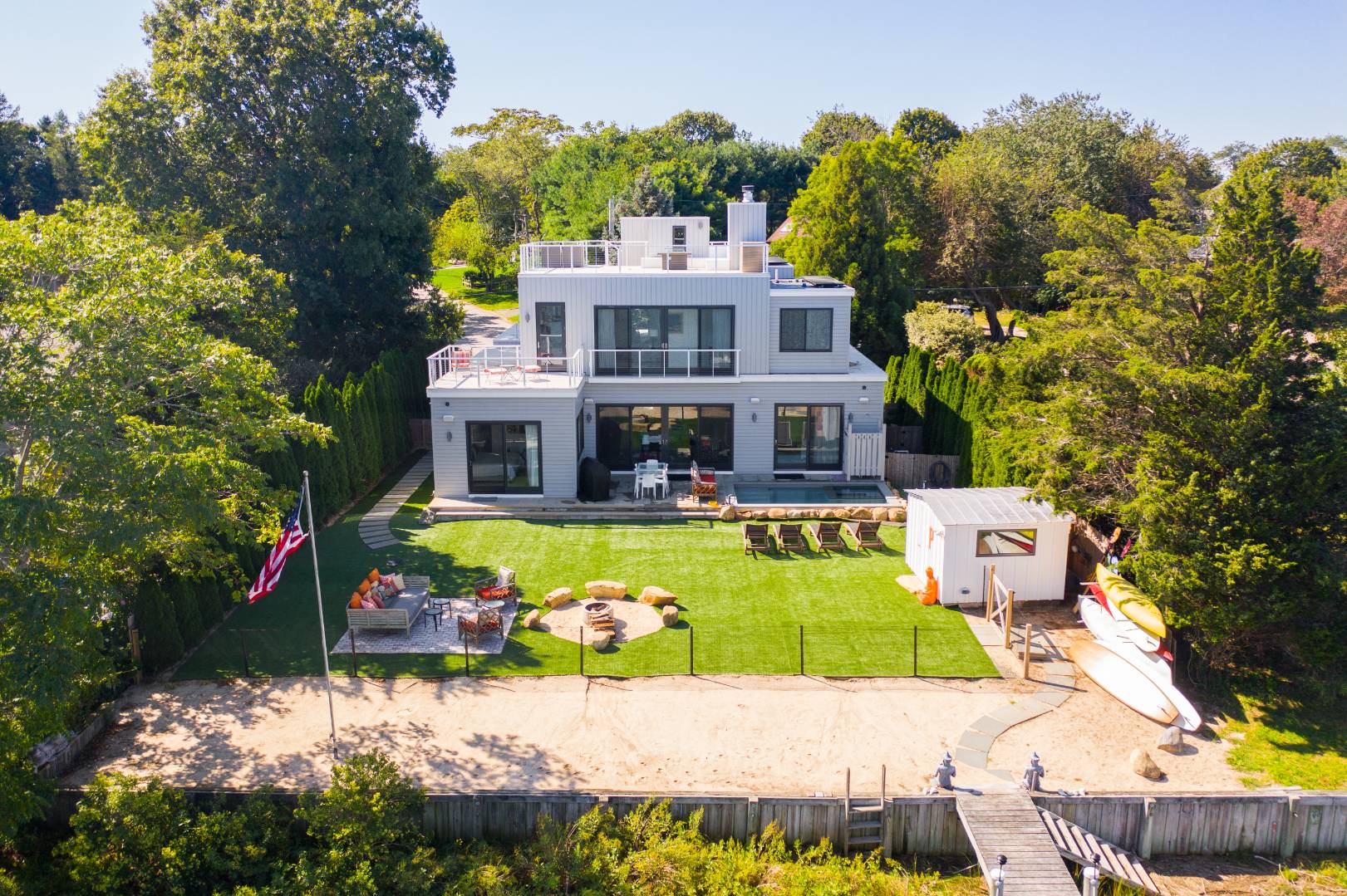43 Harbor Drive Sag Harbor, NY 11963 - Photo 6 of 29 a view of a house with a big yard and potted plants