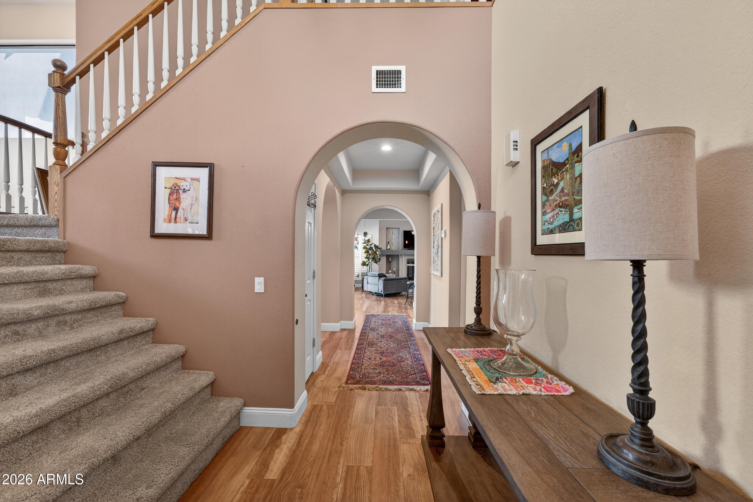 1539 East Winged Foot Road Phoenix, AZ 85022 - Photo 16 of 64 a view of a hallway with wooden floor and staircase
