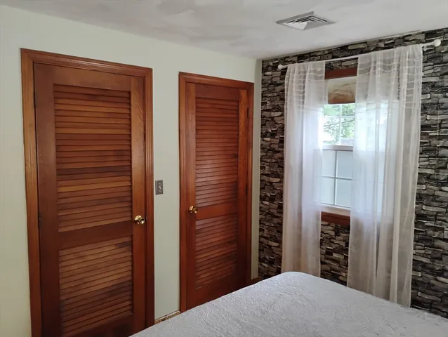 a bathroom with a sink vanity and a mirror