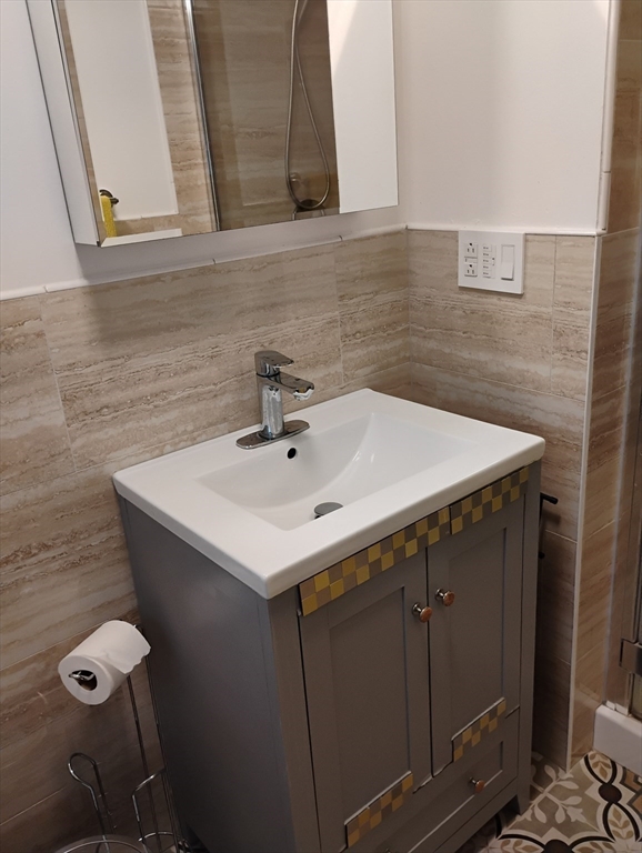 9 Packard Road Milford, MA 01757 - Photo 14 of 29 a bathroom with a sink and a mirror