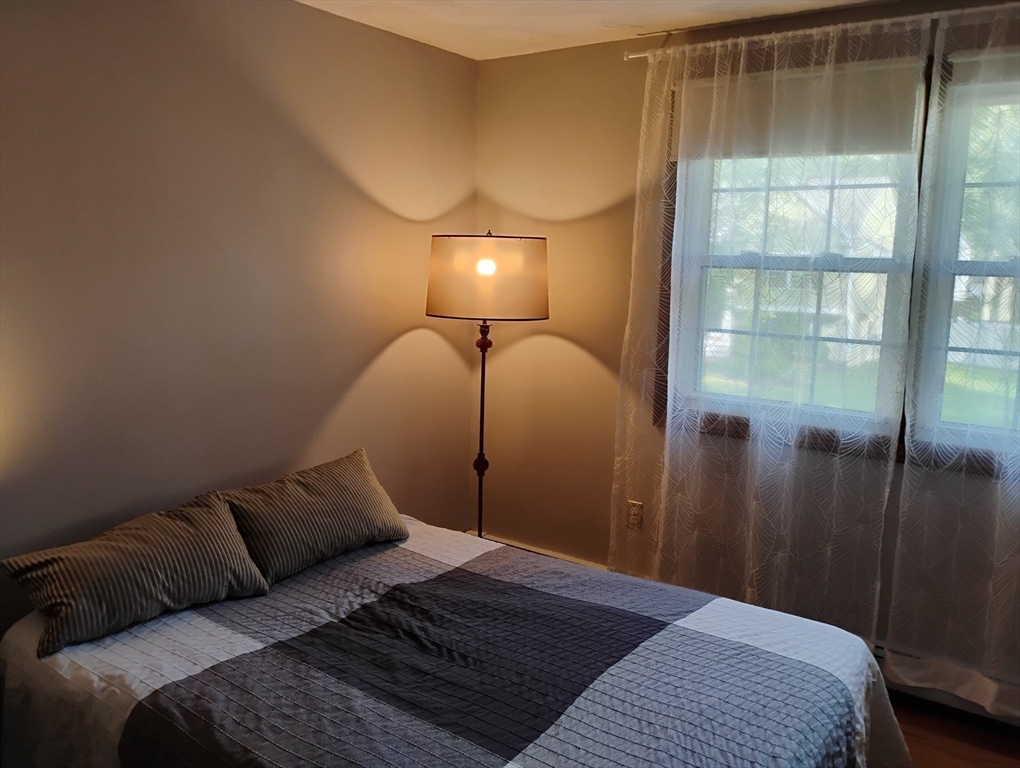 9 Packard Road Milford, MA 01757 - Photo 17 of 30 a bedroom with a bed and a window