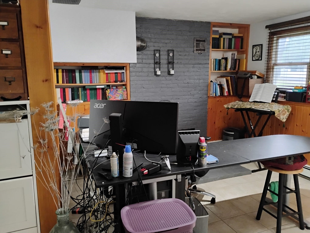 9 Packard Road Milford, MA 01757 - Photo 28 of 30 a room with furniture and a book shelf