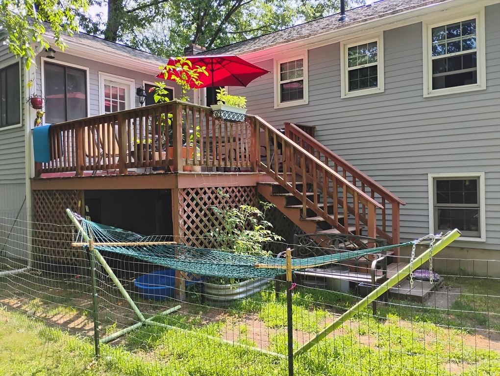 9 Packard Road Milford, MA 01757 - Photo 3 of 30 a view of house with large windows and swimming pool