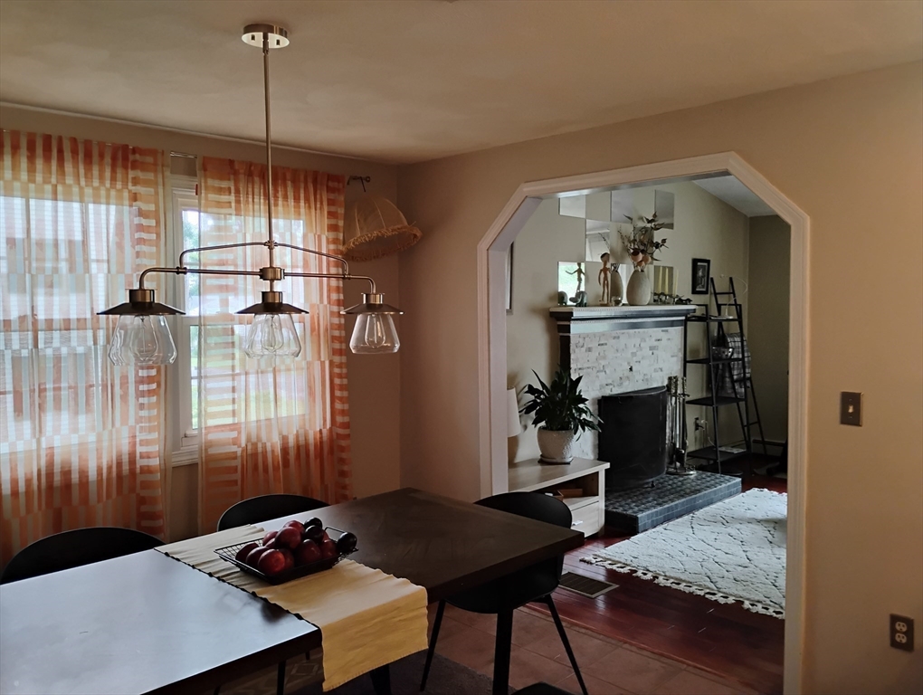 9 Packard Road Milford, MA 01757 - Photo 4 of 29 a view of a livingroom with furniture and window