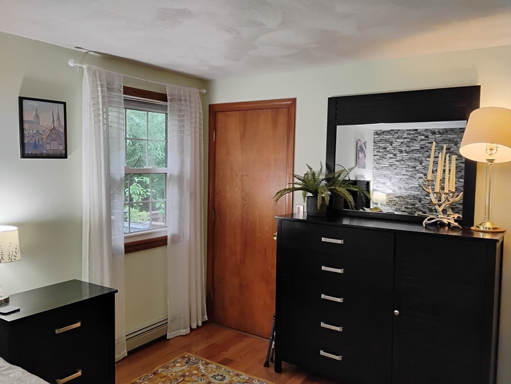 9 Packard Road Milford, MA 01757 - Photo 10 of 29 a bathroom with a sink vanity and a mirror