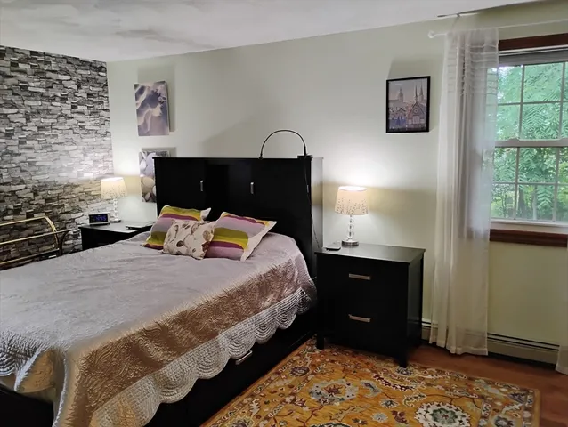 a bedroom with windows