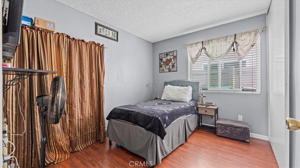 12846 Mayflower Court Riverside, CA 92503 - Photo 17 of 32 a bedroom with a bed and a window